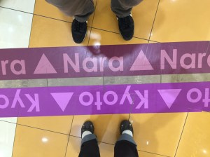 Sometimes, I do feel like we're standing on opposite sides of an issue, haha!  No, we actually were in a shopping mall and there marked the border between the two prefectures.